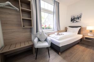 Łóżko lub łóżka w pokoju w obiekcie HeimatHerz Hotel Garni