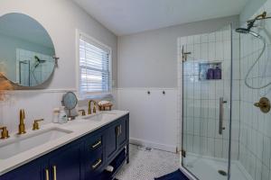 a bathroom with a sink and a glass shower at Wright Spot in Tuscaloosa +27 photos