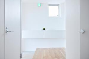 a room with white doors and a wooden floor at Nippou no Ie Kamishihoro - Vacation STAY 58990v in Kami-shihoro