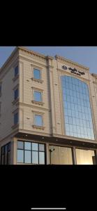 a large building with a lot of windows at White House Apartments in Khamis Mushayt