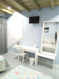 Łóżko lub łóżka w pokoju w obiekcie Casa Rural La Plata