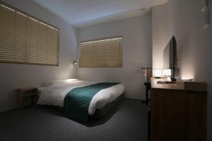 En eller flere senge i et værelse på Design Hotel Kyoto Fuyacho - Vacation STAY 65938v