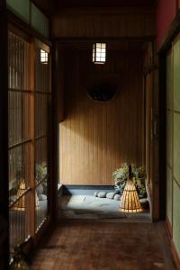 an entrance to a room with a wooden wall at Yamato Seseragi-so - Vacation STAY 67930v in Kaneuchi