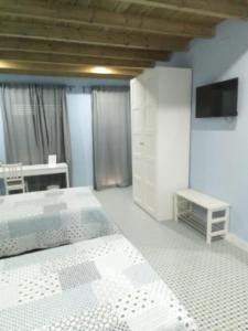 Łóżko lub łóżka w pokoju w obiekcie Casa Rural La Plata