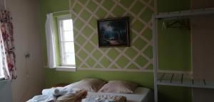 Letto o letti in una camera di Det Gamle Hotel Rudkøbing