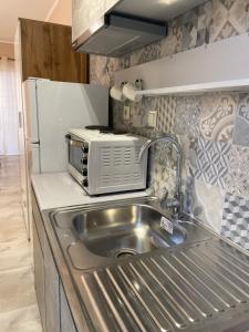 Kuchyňa alebo kuchynka v ubytovaní Apartments NANA