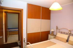 Postel nebo postele na pokoji v ubytování Villa Olympus