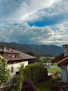 a view of the mountains from a house at M&M Apartment in Perca