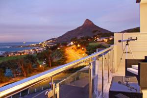 a view of a mountain from a balcony with a camera at Sea Mount in Cape Town
