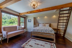 a bedroom with a bunk bed and a couch at Trinidad Pearl in Trinidad