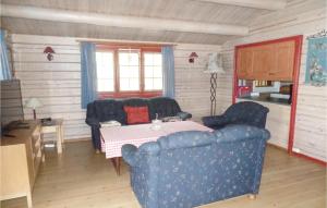 a living room with a couch and a table at Bergheim in Vikersund