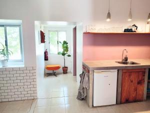 a kitchen with a sink and a counter top at Visit PachaMama Community in Alcácer do Sal