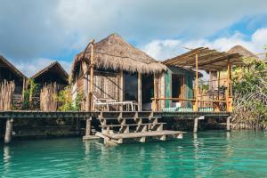 a house on a dock in the water at Embajada Universal By La Eufemia Group in Huay Pix