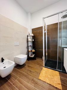 a bathroom with a shower and a toilet and a sink at B&B letterario Palazzo Pistocchi in Teramo +60 photos