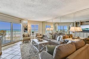 a living room with a couch and a table at Inlet Reef 205 Destin Apts in Destin