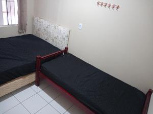 1 dormitorio con 2 camas en una habitación en Casa de Praia Armacao de Itapocoroi 261 - Próximo ao Parque Beto Carrero World, en Penha