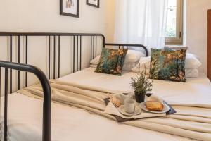 Postel nebo postele na pokoji v ubytování B&B 503 di Alessio e Orsola