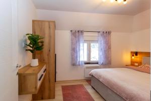 Llit o llits en una habitació de Ema apartman - Zlatar
