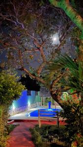 a view of a pool at night at Pousada Brasil - São Miguel do Gostoso in São Miguel do Gostoso