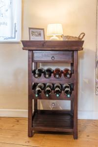 a table with a bunch of wine bottles at Chez Jade et Ambre in Eguisheim