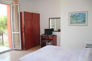 Nuovo Hotel San Martino tesisinde bir odada yatak veya yataklar