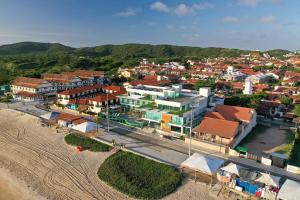 an aerial view of a city with a town at Paradiso Peró Praia Hotel in Cabo Frio