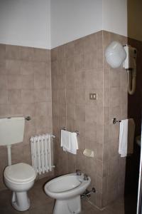 a bathroom with a toilet and a sink at Nuovo Hotel San Martino in Casalecchio di Reno