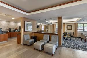 a lobby of a hospital with chairs and a bar at Best Western Plus Boulder Louisville in Louisville