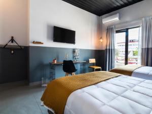 เตียงในห้องที่ Hotel NEXT