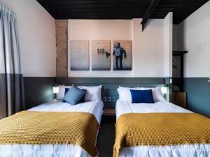 เตียงในห้องที่ Hotel NEXT