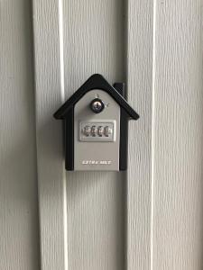 a black and white electrical outlet on a door at John&Jane's House in Surrey