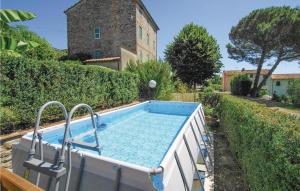 a swimming pool in the yard of a house at Nido D'amore in Castelvecchio
