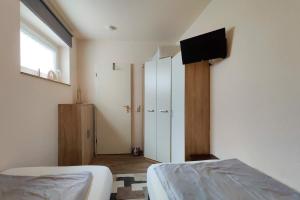 Postel nebo postele na pokoji v ubytování Strandnahe-Ferienwohnung-22-im-Appartmenthaus-Poseidon-Duhnen