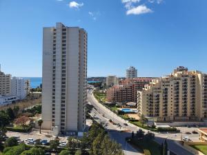an aerial view of a city with tall buildings at The Roof Elite in Portimão