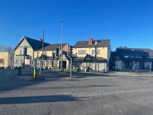 an empty street in a small town with buildings at The Welcome Apartment in Blackpool