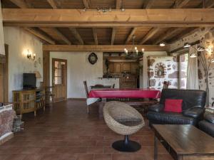 a living room with a table and a couch at Gîte Audes, 6 pièces, 10 personnes - FR-1-489-119 in Audes