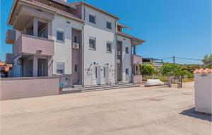 a large white building with a driveway in front of it at 2 Bedroom Amazing Apartment In Kanica in Zaglavice