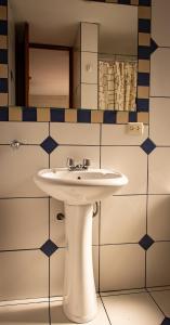 a bathroom with a white sink and a mirror at Hotel La Posada de Ugarte in Arequipa