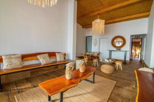 a living room with a couch and a table at Hotel Boutique Beso de Sal in Colán