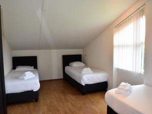 Ένα ή περισσότερα κρεβάτια σε δωμάτιο στο Holiday Home in Flevoland with Pool