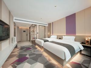 Postel nebo postele na pokoji v ubytování Lavande Hotel Qihe Economic Development Zone