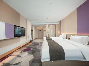 Postel nebo postele na pokoji v ubytování Lavande Hotel Qihe Economic Development Zone