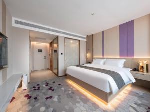 Postel nebo postele na pokoji v ubytování Lavande Hotel Qihe Economic Development Zone