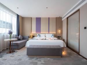 Postel nebo postele na pokoji v ubytování Lavande Hotel Qihe Economic Development Zone