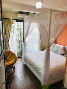 Ένα ή περισσότερα κρεβάτια σε δωμάτιο στο Chez Madame Binh