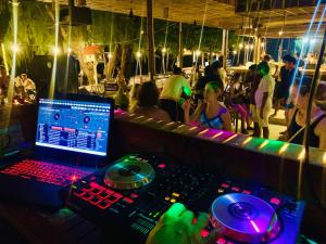 a person sitting in a dj booth at a party at Onederz Koh Rong Sanloem in Koh Rong Sanloem
