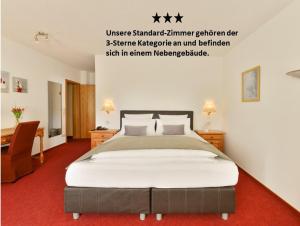 Ein Bett oder Betten in einem Zimmer der Unterkunft Hotel Antoniushütte
