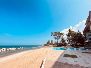 a view of the beach and the ocean at ēRYA by SURIA Cherating in Cherating