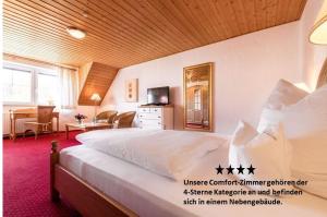 Ein Bett oder Betten in einem Zimmer der Unterkunft Hotel Antoniushütte