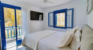 Postel nebo postele na pokoji v ubytování Meraki Beachfront + 37 fotografií